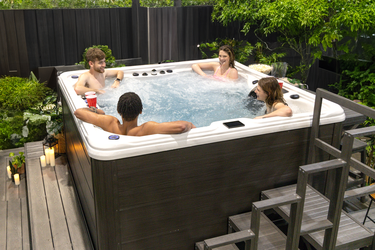 4 people using a hot tub